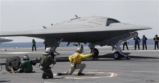 A Navy X-47B drone is launched off the nuclear powered aircraft carrier USS George H. W. Bush off the coast of Virginia. Attorney General Eric Holder said the United States considers drone strikes a viable option to target United States citizens outside the country who pose a threat to the U.S. and cannot feasibly be captured. (AP Photo/Steve Helber)