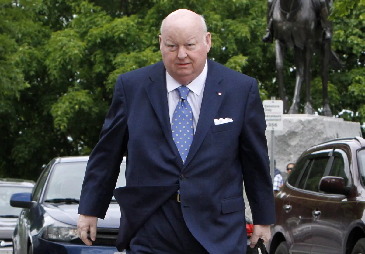 Sen. Mike Duffy makes his way to the Senate on Parliament Hill in Ottawa, Canada, on May 28, 2013. (The Canadian Press/Fred Chartrand)