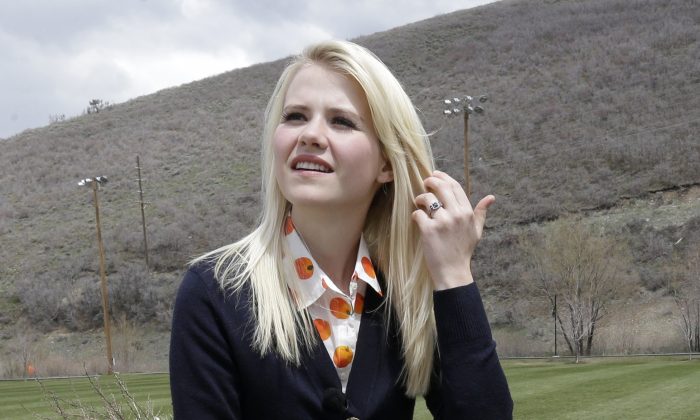 Elizabeth Smart looks on before an interview Tuesday, May 7, 2013, in Park City, Utah. Smart said she's elated to hear about three Cleveland women who escaped Monday after they disappeared a decade ago. Smart was kidnapped from her bedroom in Salt Lake City when she was 14. She was freed nine months later when she was found walking with her captor on a suburban street in March 2003. (AP Photo/Rick Bowmer)