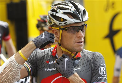In this July 6, 2010 file photo, Lance Armstrong of the United States, arrives prior to the start of the third stage of the Tour de France cycling race in Wanze, Belgium. Nike Inc. is cutting ties with the Livestrong cancer charity. The move by the sports company ends a nine-year relationship that helped the foundation raise more than $100 million and made the charity's signature yellow wristband an international symbol for cancer survivors. (AP Photo/Christophe Ena, FIle)