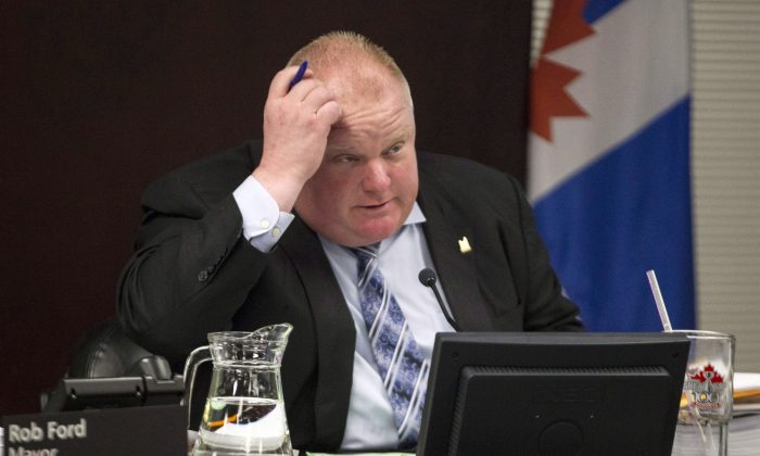 Toronto Mayor Rob Ford attends an executive committee meeting at city hall in Toronto on Tuesday, May 28, 2013. The controversy around an alleged video appearing to show Ford smoking crack cocaine showed no signs of diminishing Wednesday as the leader of Canada's largest city sidestepped questions about a new twist in the scandal. (THE CANADIAN PRESS/Chris Young)