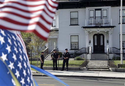 Police keep watch outside Graham, Putnam, and Mahoney Funeral Parlors in Worcester, Mass., Monday, May 6, 2013 where the body of killed Boston Marathon bombing suspect Tamerlan Tsarnaev is being prepared for burial. (AP Photo/Elise Amendola)