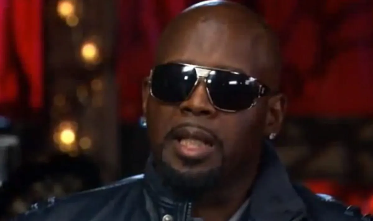 A screenshot of YouTube shows Tim Dog in an interview.