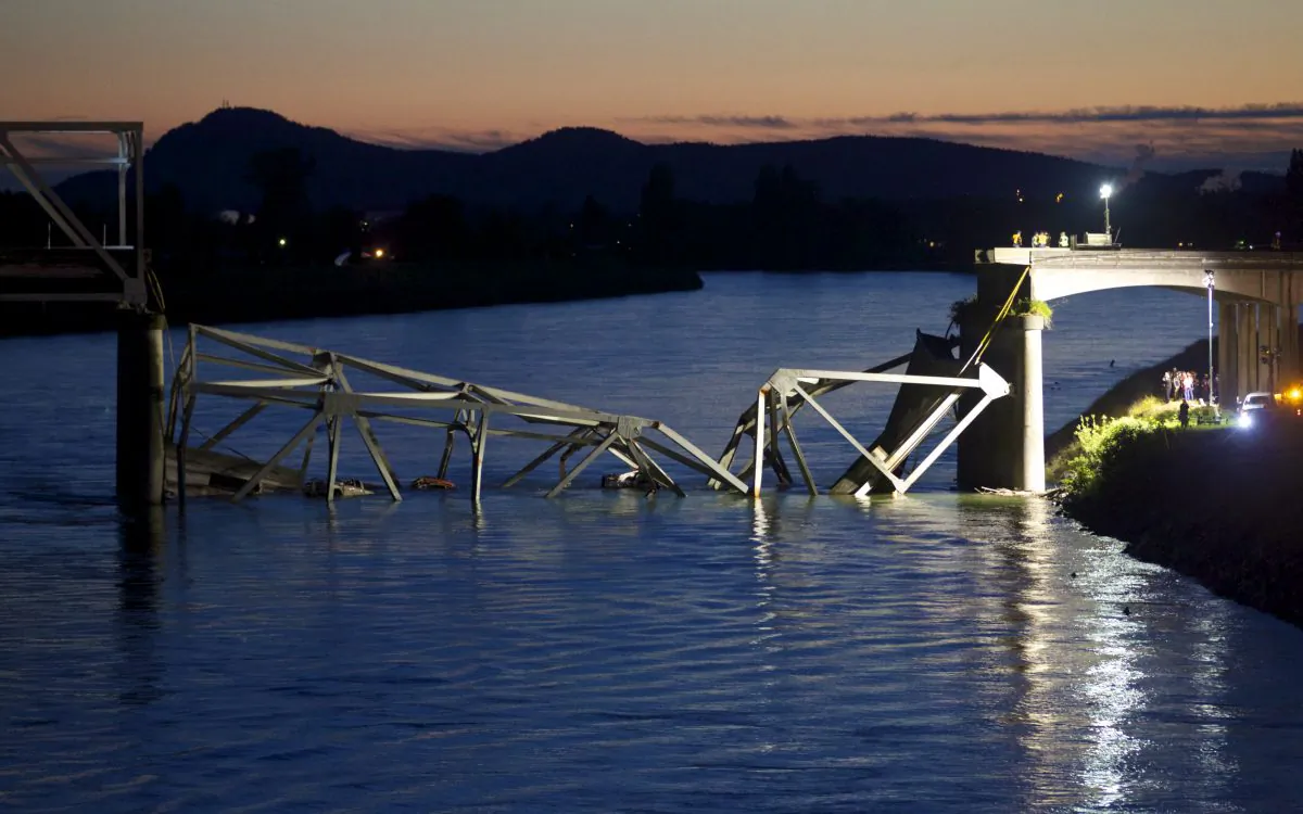 Crews survey the scene of a bridge collapse on Interstate 5 on May 23, 2013, near Mt. Vernon, Washington. I-5 connects Seattle, Washington, to Vancouver, B.C., Canada. No deaths have been reported, and three people were taken to hospitals with injuries. (Stephen Brashear/Getty Images)