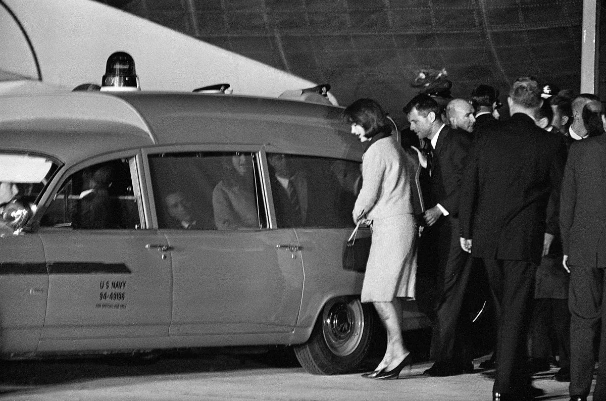 US first lady Jacqueline Kennedy and Robert Kennedy get into the Navy ambulance which carries the body of slain President John Fitzgerald Kennedy, on November 22, 1963 at Andrews Air Force Base, just outside Washington, DC. (AFP/Getty Images)