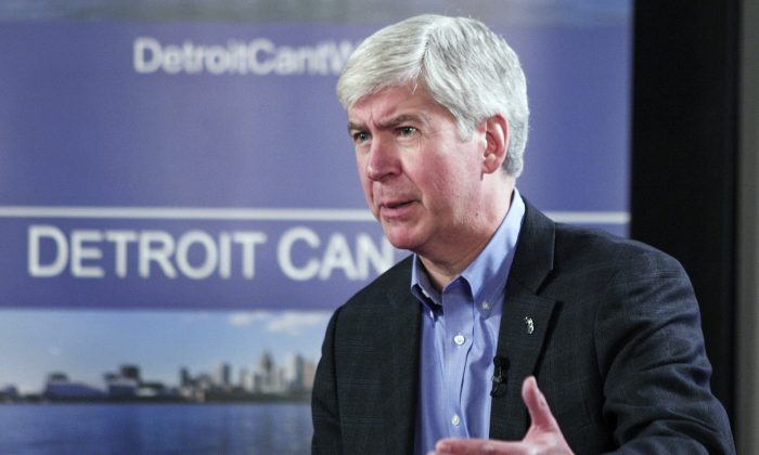 Mich. Gov. Rick Snyder announces his appointment of an emergency financial manager for the city of Detroit during a town hall meeting at Wayne State University in Detroit, March 1. Detroit has nearly $16 billion in debts and liabilities.
(Bill Pugliano/Getty Images)