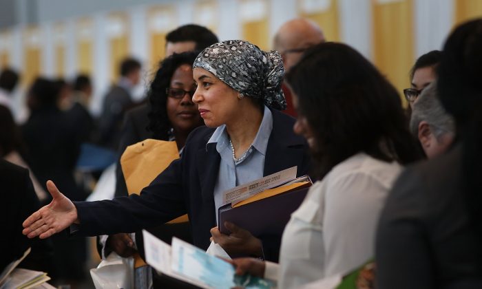 Job seekers meet with employers at the 25th Annual CUNY big Apple Job and Internship Fair at the Jacob Javits Convention Center on April 26 in New York City. Despite efforts unemployment among young people ages 18-29 remains high.  (Spencer Platt/Getty Images)