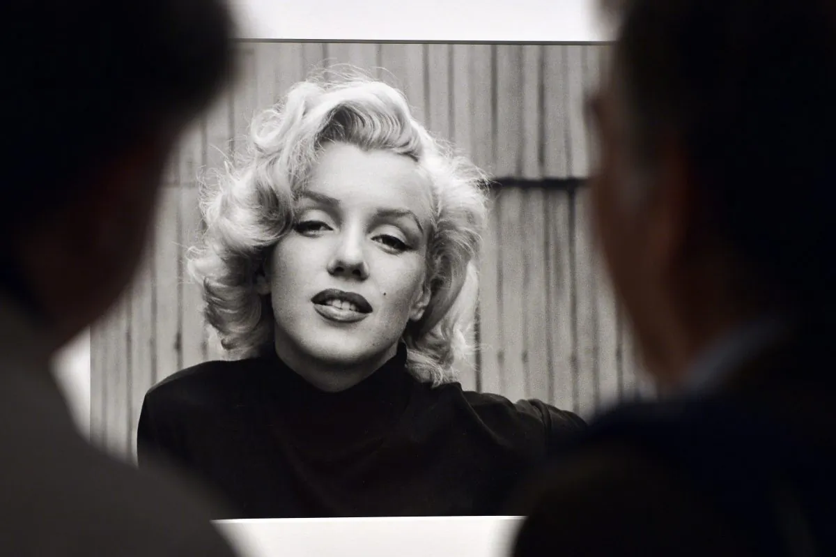 Visitors look at Alfred Eisenstaedt's "Marilyn Monroe, Hollywood, USA, 1953" during the "Life. I grandi fotografi" ("Life. The great photographers") exhibition at the auditorium in Rome, Italy, on April 30, 2013. (Gabriel Bouys/AFP/Getty Images)
