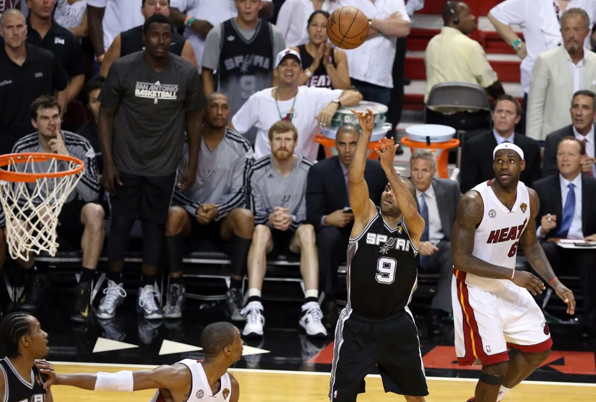 Tony Parker #9 of the San Antonio Spurs makes a shot with 5.2 seconds left in the fourth quarter against LeBron James #6 of the Miami Heat to ultimately win Game One of the 2013 NBA Finals at AmericanAirlines Arena on June 6, 2013 in Miami, Florida. (Christian Petersen/Getty Images)