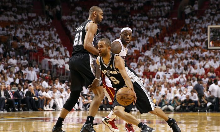 MIAMI, FL - JUNE 09: Tony Parker #9 of the San Antonio Spurs uses a screen from Tim Duncan #21 to get around LeBron James #6 of the Miami Heat in the third quarter during Game Two of the 2013 NBA Finals at AmericanAirlines Arena on June 9, 2013 in Miami, Florida. (Photo by Christian Petersen/Getty Images)