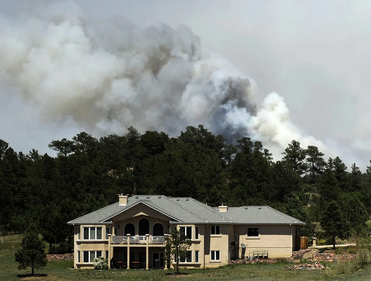 Smoke fills the air from the Black Forest Fire near Colorado Springs, Colorado on Wednesday, June 12, 2013. Many residents, including John Bissett, the president of the Housing and Building Association of Colorado Springs, had to evacuate their homes to find shelter with friends or in their motorhomes. (Photo by Chris Schneider/Getty Images)