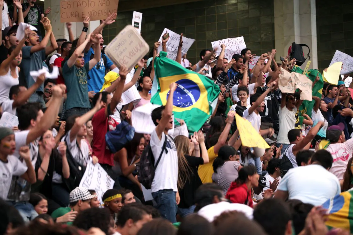 Protesters shout during a demonstration in Belo Horizonte, Brazil, June 19, 2013. Protests initially sparked by a hike in bus fares in São Paulo quickly spiraled into nationwide marches against corruption. (Bernardo Salce/AFP/Getty Images)