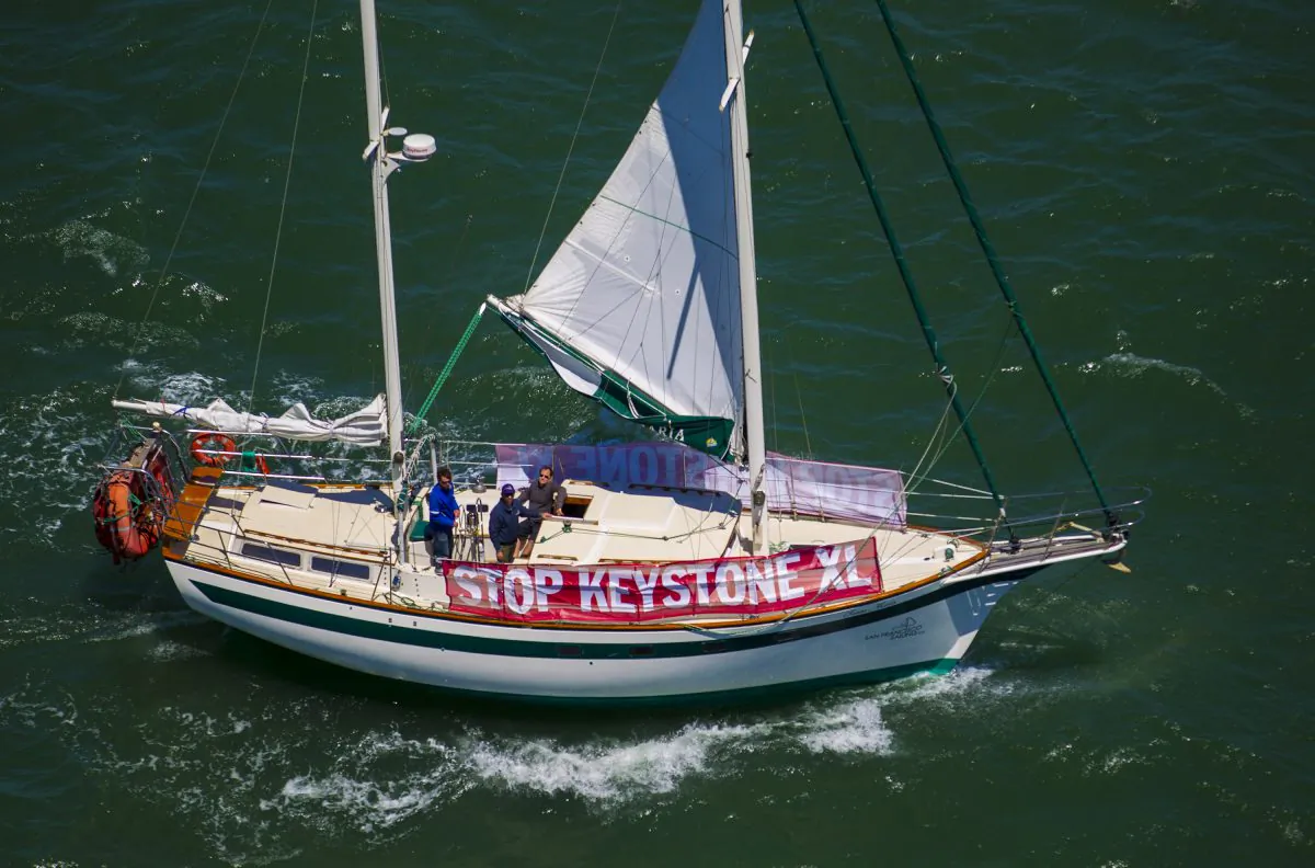 A boat sails in the bay while sporting a banner against the Keystone XL pipeline on June 20, 2013, in San Francisco. The Obama administration announced a new climate policy without rejecting the pipeline. (Kim White/Getty Images)