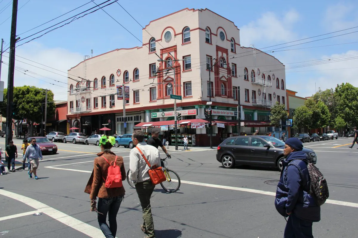 Pedestrians on Valencia Street in the Mission District in San Francisco, Calif., June 5. Merchants reported that more residents shop locally after Valencia Street received safety improvements, like sidewalk widening and traffic-lane slimming. (Christian Watjen/The Epoch Times)