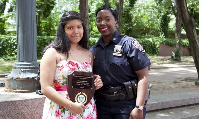 Police Officer Shantel McKinnes and essay contest winner Vanessa Vicuna outside of NYC Police Headquarters on June 5. (Samira Bouaou/The Epoch Times)