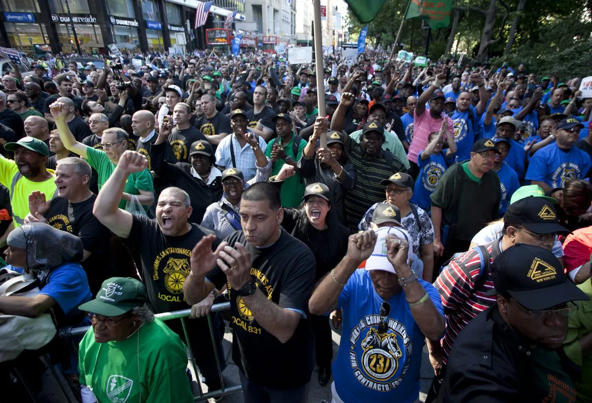 City workers rally next to City Hall over city’s failure to renew their contracts on June 12. (Samira Bouaou/The Epoch Times)