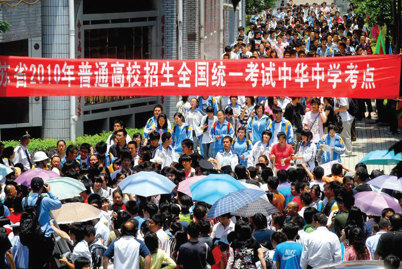 Having just taken the "gaokao," or college entrance exam, students walk out of the test site at the China Middle School in Nanjing City. The exam, which was given throughout China during the period June 6-9, has traditionally been seen as the gateway to higher education and a good job. (The Epoch Times Photo Archive) 