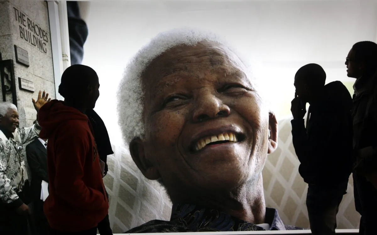 Giant photographs of Nelson Mandela displayed at the Nelson Mandela Legacy Exhibition at the Civic Centre in Cape Town, South Africa, Thursday, June 27, 2013. (AP Photo)