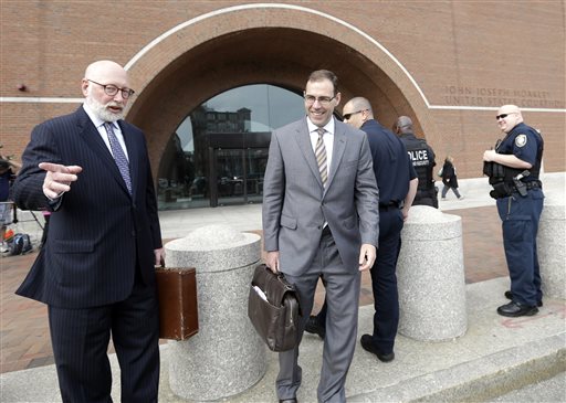 Defense attorneys J.W. Carney Jr., left, and Henry Brennan, right, leave federal court in Boston, Monday, June 3, 2013, after a pre-trial hearing for accused mobster James "Whitey" Bulger. Jury selection begins Tuesday. (AP Photo/Elise Amendola)