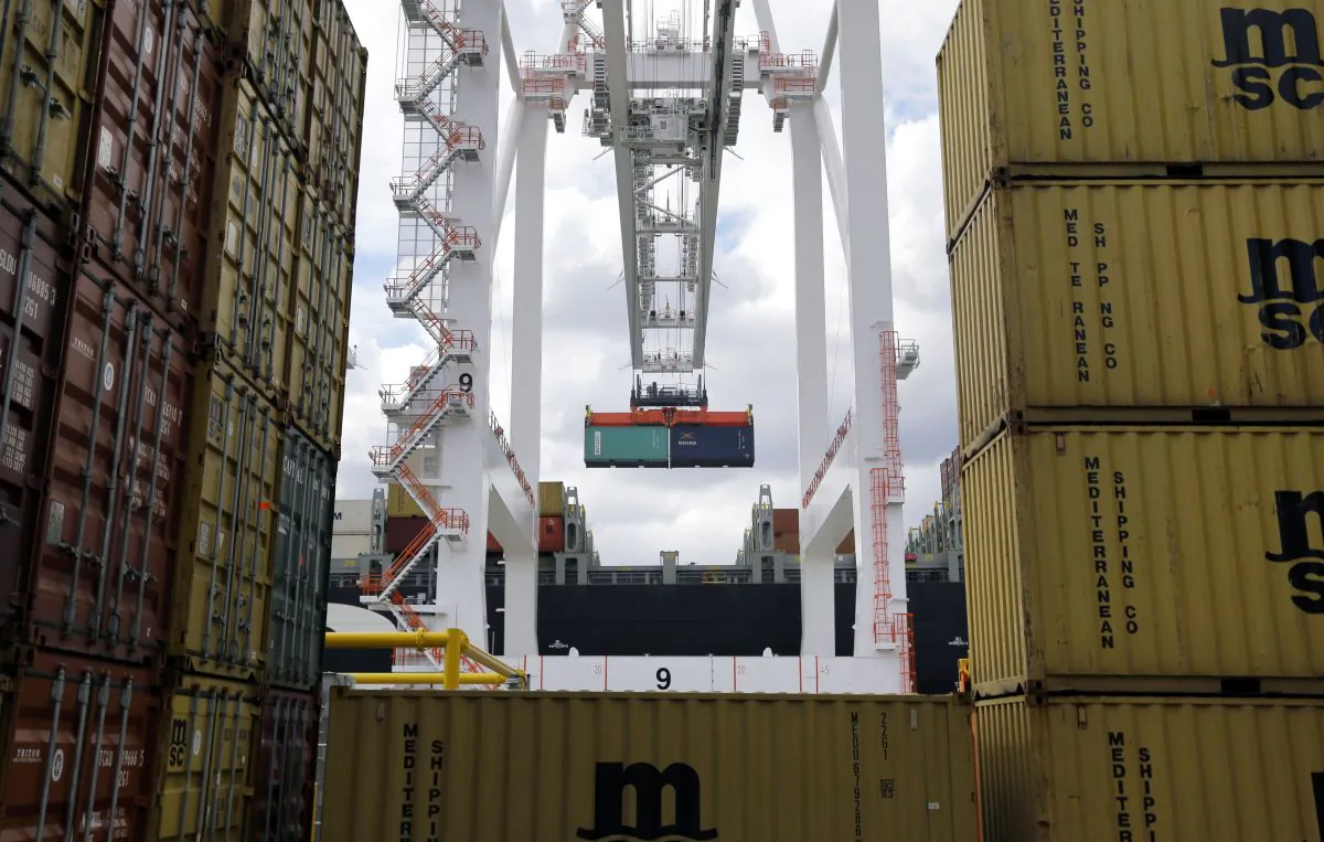 A crane removes a container from a ship at the Port of Baltimore's Seagirt Marine Terminal. On March 26, 2024, the Dali, a 95,000-ton Singapore-flagged carrier loaded with 262,000 tons of cargo, was struggling with electrical issues before it crashed into the Francis Scott Key Bridge. (Patrick Semansky/AP Photo)