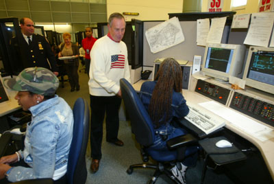 Mayor Michael R. Bloomberg visits the 911 call center on Thanksgiving Day on November 25, 2004. The Mayor visited the call center to thank the call takers for working on Thanksgiving Day. (Kristen Artz/Courtesy NYC.gov)