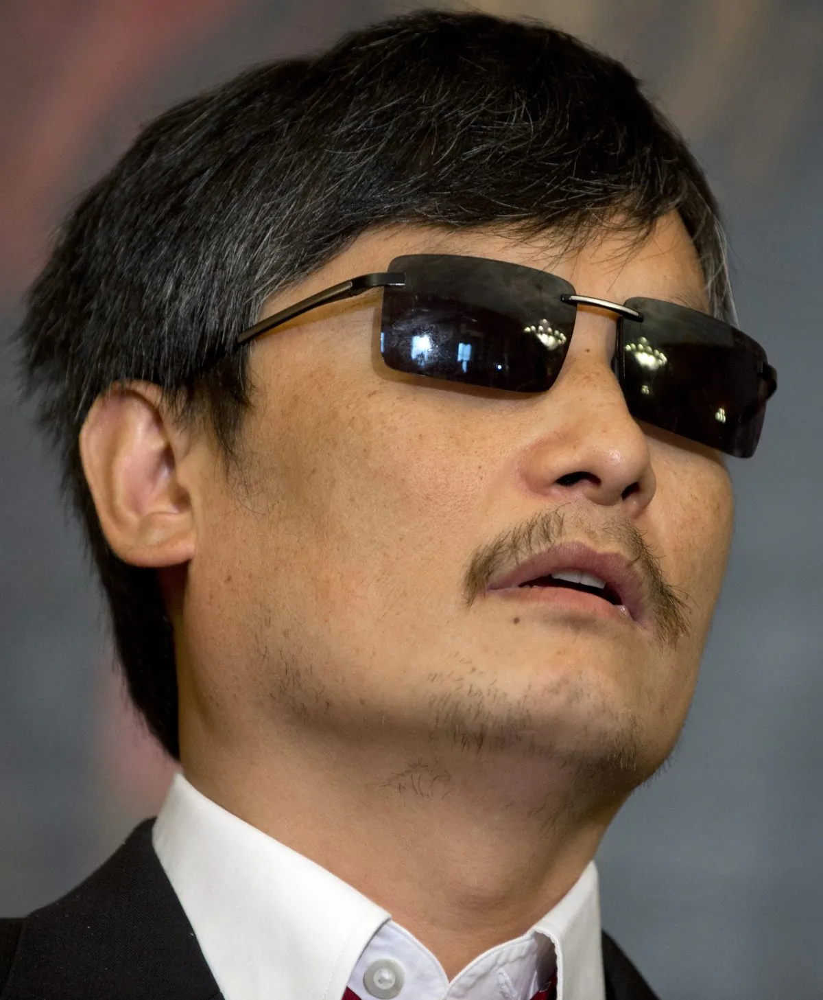 Chinese human rights activist Chen Guangcheng attends a press conference with Speaker of the House John Boehner and House Minority Leader Nancy Pelosi at the US Capitol in Washington, DC, August 1, 2012. (AFP/GettyImages/Saul Loeb)