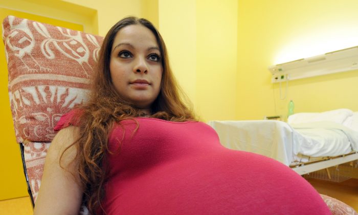 Twenty three-year-old Alexandra Kinova from Milovice, about 30 km east of Prague, smiles as she waits for the delivery of quintuplets at Prague's maternity hospital in Podoli Wednesday, May 29, 2013. (AP Photo,CTK/Stanislav Zbynek)