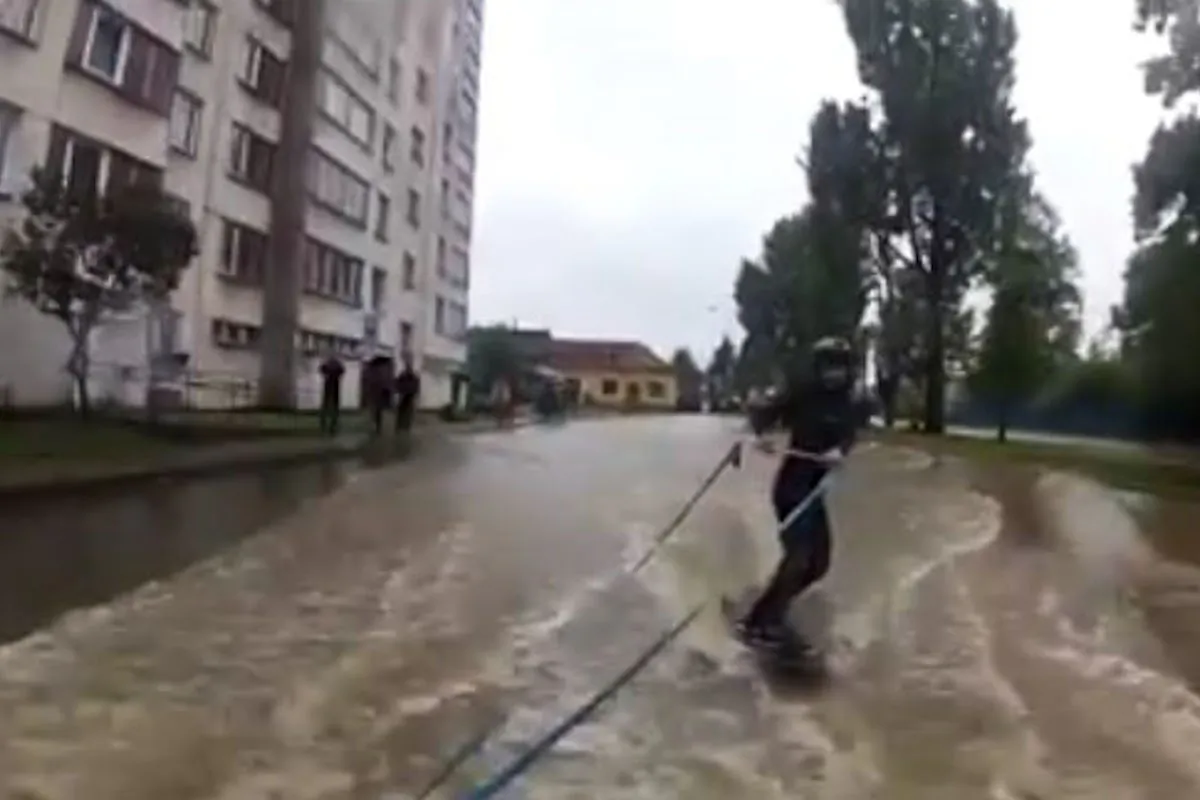 A wake boarder rips through the streets of Czech Republic during flooding in a video posted to YouTube June 2, 2013. (Screenshot/Youtube)