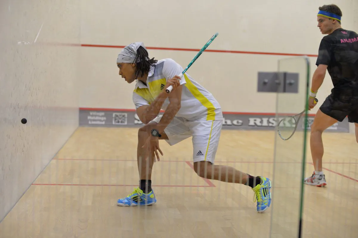 No.1 and winner of the tournament Alister Walker (Botswana) plays from the back-hand corner in the Final against Laurens Jan Anjema (Netherlands). Walker went on to win in three straight games. (Bill Cox/The Epoch Times)