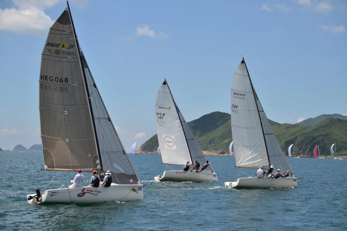 SMS Sports boats ‘Merlin’ (winner) leads ‘Fly By Wire’ (second place) and ‘Side Winder’ (fourth) after the start of Race-1 of the Hebe Haven Yacht Club Typhoon Series 2013 on Sunday June 2. (Bill Cox/The Epoch Times)