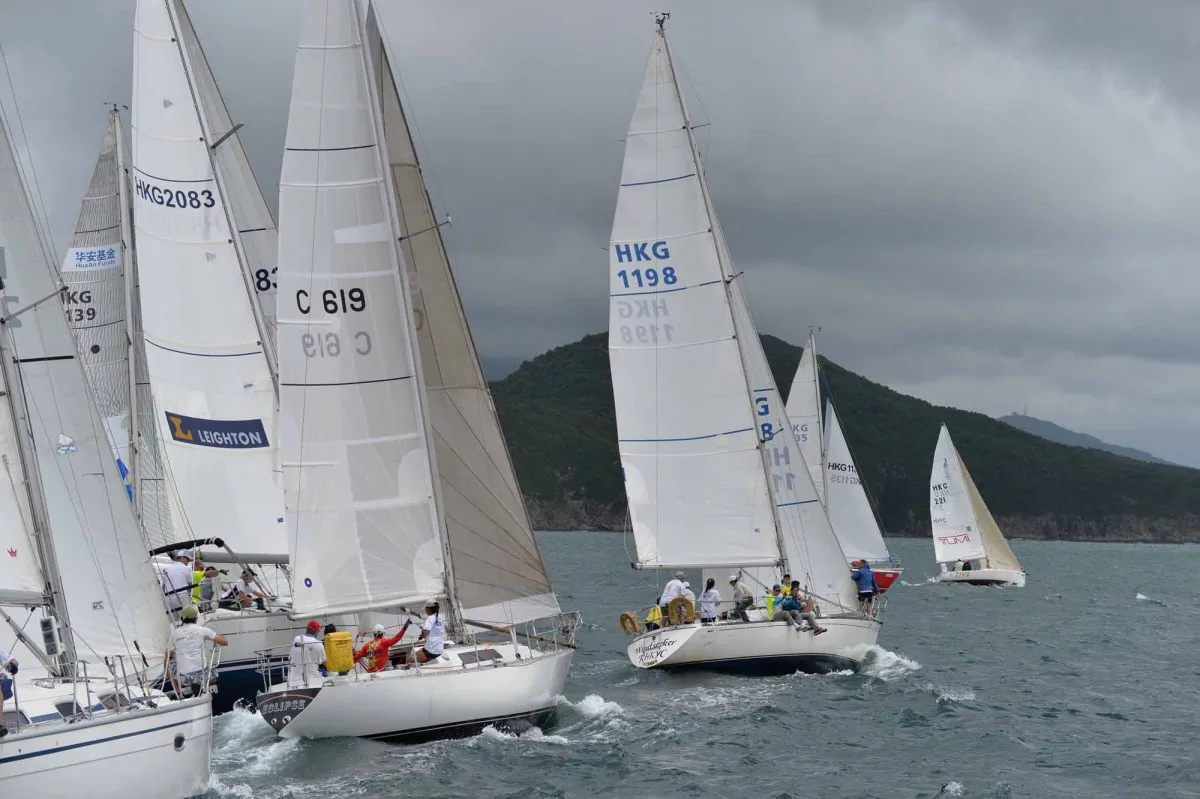 Competitive start ... HKPN boats prepare to start Race-2 of the Hebe Haven Typhoon Series on Sunday June 16, 2013. ‘Scintilla’ (sail No. 2083) won the race from ‘Windseeker’ (1198) and ‘GA’. (Bill Cox/Epoch Times)