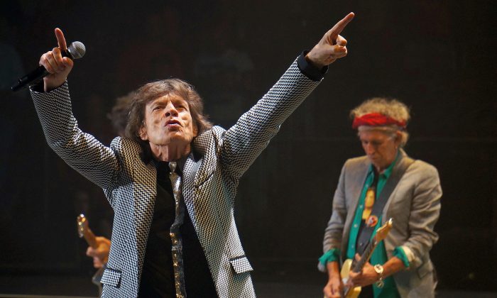 Mick Jagger of the Rolling Stones performs with the Rolling Stones, June 21, 2013, at the Wells Fargo Center in Philadelphia, Pa. (AP Photo/The Key West Citizen, Rob O'Neal)