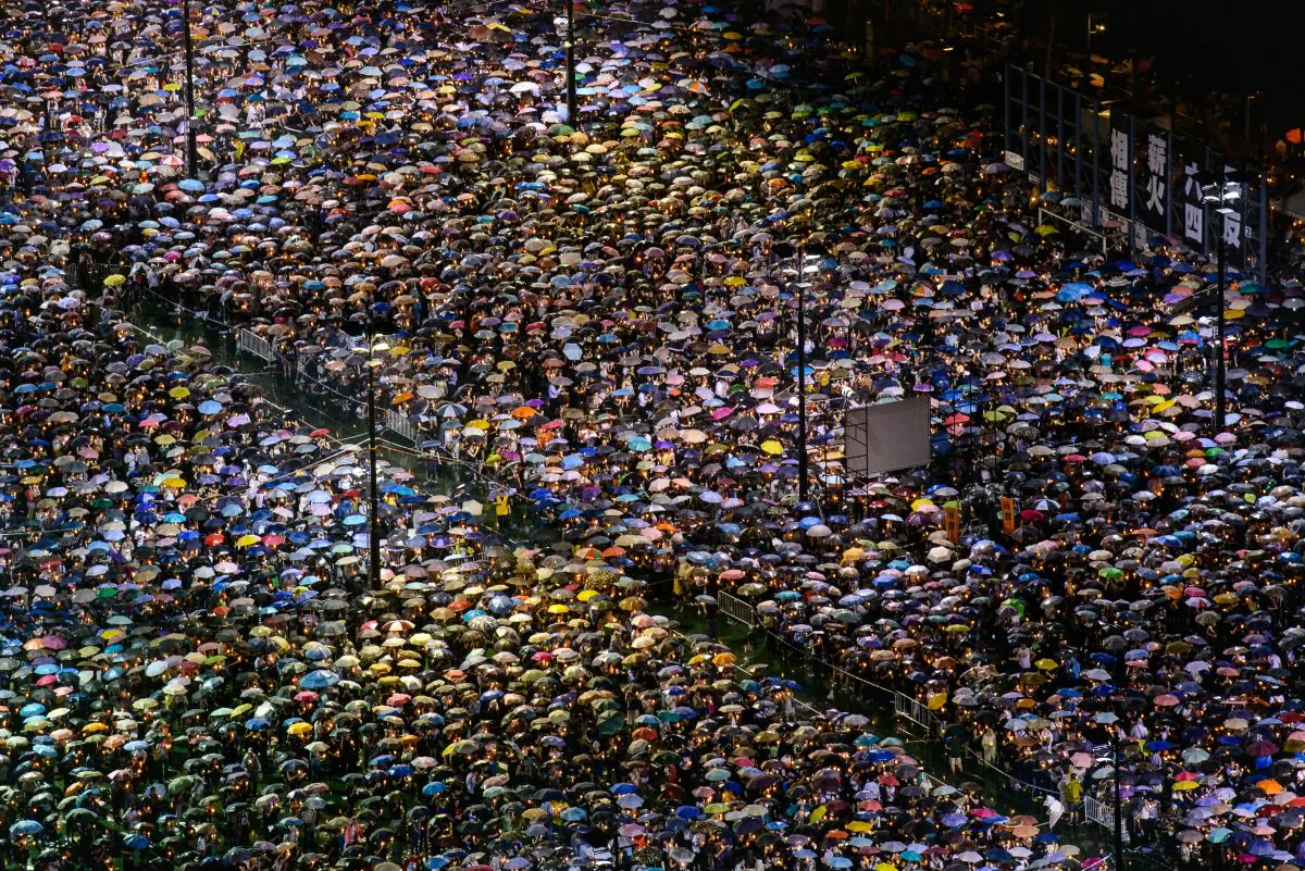 Close to 150,000 people braved the rain on Tuesday to attend the annual candlelight vigil in Hong Kong to remember the victims of the Tiananmen Square Massacre. (Poon Zoi-syu/The Epoch Times)