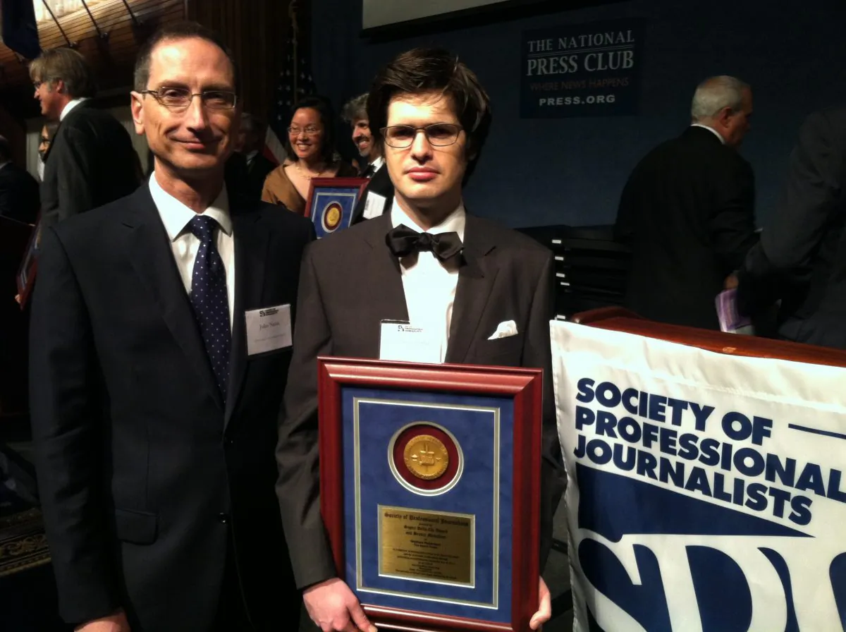 John Nania (l), editor-in-chief of the Epoch Times, with award-winning reporter Matthew Robertson at the National Press Club in Washington, D.C., June 21, 2013. Robertson was recognized for excellence in reporting for his series on forced, live organ harvesting in China. (Genevieve Belmaker/Epoch Times)