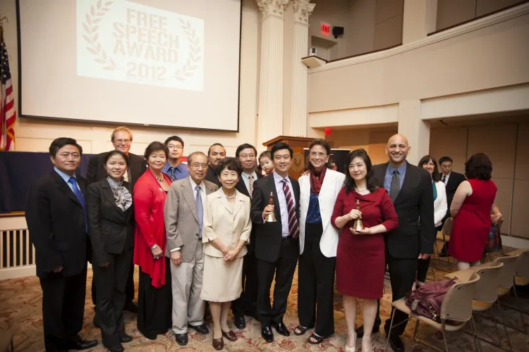 A group photo at the  45th World-Fest Houston Film Festival on April 23, 2012. From R to L: Film director Michael Perlman, Jennifer Zeng, Margaret Chew Barringer, Kean Wong, NTD President Zhong Lee, and Kean Wong's parents. On the far left is Charles Lee. Free China has recently opened for its theatrical release in the United States. (Edward Dai/The Epoch Times) 