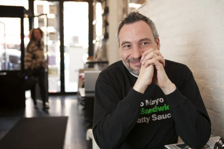 Chef Michael Guerrieri of City Sandwich weighs the impact an increase in the minimum wage, paid sick leave, and new Obamacare legislation would have on his business. (Samira Bouaou/The Epoch Times)