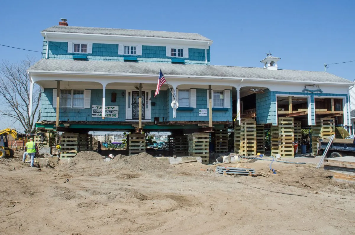 After the storm surge from Hurricane Sandy flooded their house with 5 feet of water, the homeowners made the decision to elevate their house above the new flood level of 12 feet determined by New York State and FEMA in Freeport, N.Y., May 20. (Kenneth Wilsey/FEMA)