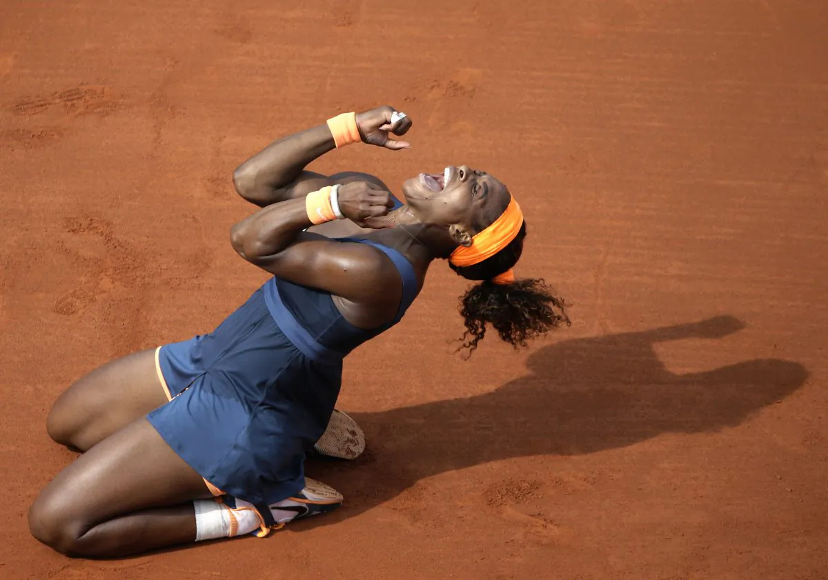 Serena Williams celebrates her victory over Maria Sharapova at the end of their French Open women’s singles final match at the Roland Garros stadium in Paris on June 8, 2013. (Kenzo Tribouillard/AFP/Getty Images) 