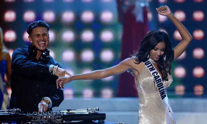 DJ Paul 'Pauly D' DelVecchio (L) performs as Miss South Carolina USA Megan Tyler Pinckney walks on stage during the 2013 Miss USA pageant at PH Live at Planet Hollywood Resort & Casino in Las Vegas, Nev., on June 16, 2013. (Ethan Miller/Getty Images)