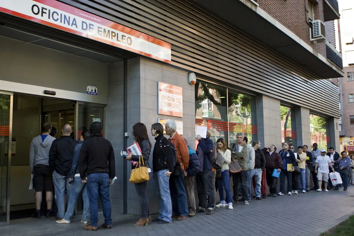 People wait in line at a government employment office in Madrid on June 4, 2013. (Sebastien Berda/AFP/Getty Images)