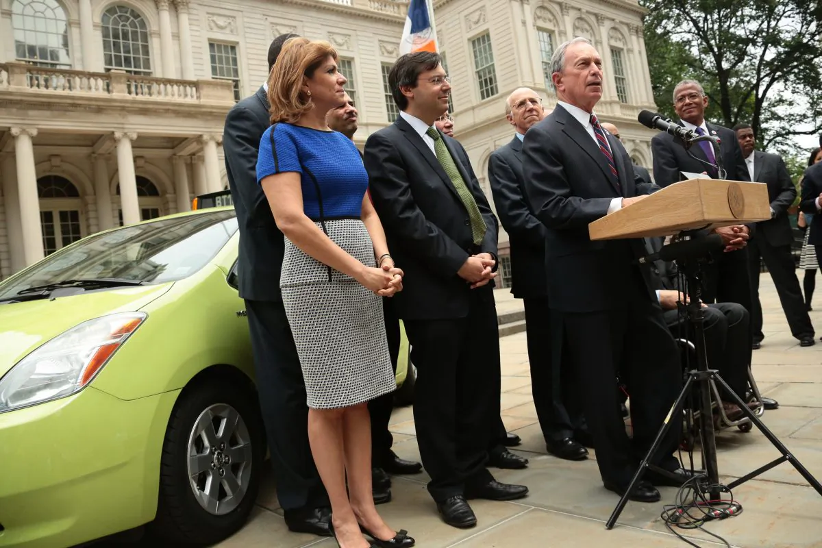 Mayor Michael Bloomberg (C) stands in front of a new green livery service car for the outer boroughs on June6, 2013, and announces the city’s victory in a court ruling, which will bring 18,000 livery taxis to the outer borough in three years. The ruling upheld a law which also allows 2,000 new yellow cab medallions for sale, which will begin in October 2013. (Edward Reed/The Mayor’s Office) 