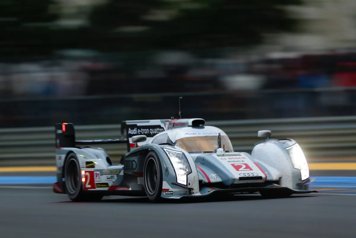 Tom Kristensen, Allan McNish, and Loïc Duval drive the #2 Audi R18 e-tron quattro towards victory in the 90th Le Mans 24 at Circuit de la Sarthe at Le Mans, France, June 23, 2013. (Audi Motorsports)