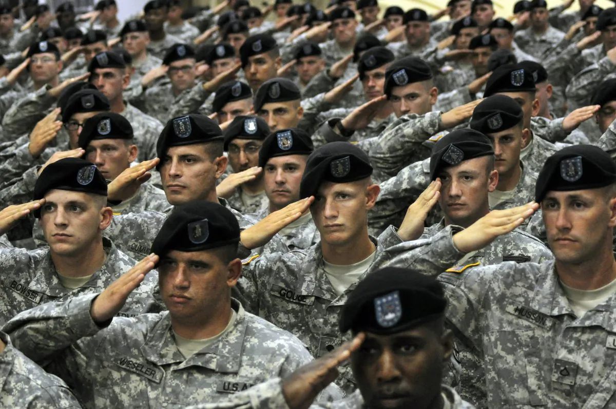 Soldiers from the 10th Mountain Division saluting during the National Anthem in Fort Drum, N.Y. (Heather Ainsworth/AP Photo)