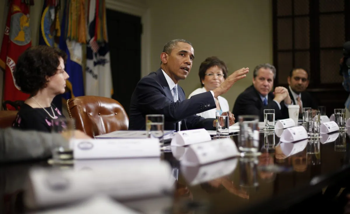 Valerie Jarrett is seen sitting to the left of former President Barack Obama in a file photo. (Pablo Martinez Monsivais/AP Photo)
