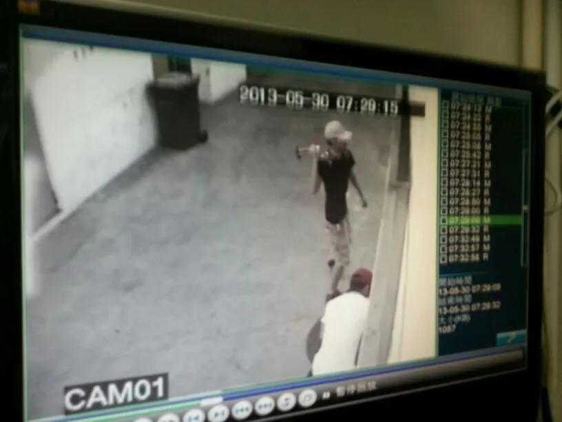 Unidentified men attack the door of the Epoch Times print shop in Hong Kong on the evening of May 30. The attack appeared to be part of a recent series of violent incidents directed against media organizations and individuals, which many in Hong Kong suspect may have been directed from mainland China. (Epoch Times)