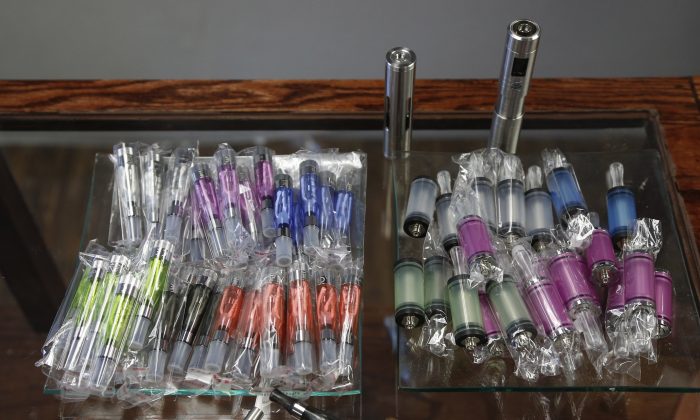 A file photo of electronic cigarettes at the OKC Vapor shop in Oklahoma City on April 19, 2013. E-cigarettes will now be regulated like medicine in the U.K., the government announced June 12, 2013. (AP Photo/Sue Ogrocki)