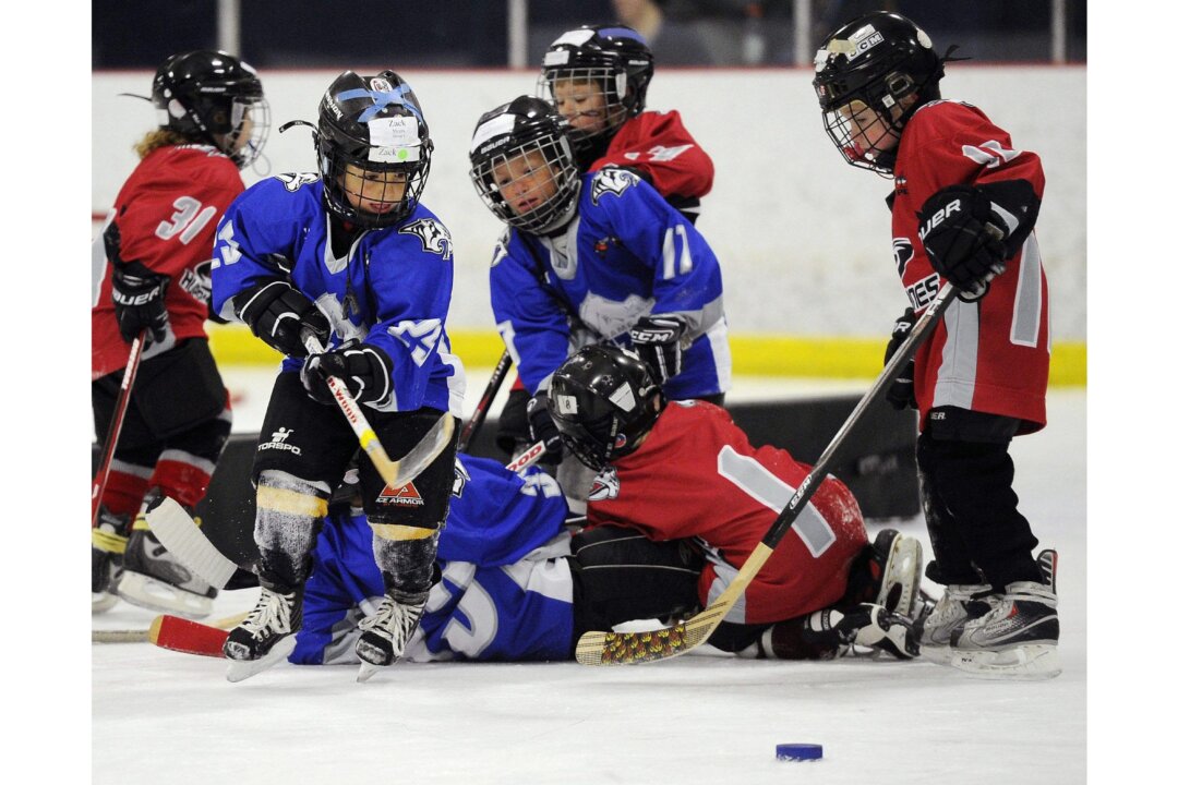Along with reducing the number of concussions, Hockey Canada’s removal of body-checking for children under 13 will also benefit their hearing health. High-impact sports, including hockey, have long been known to diminish hearing, leading to such problems as dizziness, vertigo, and motion sickness. (AP Photo/Sanford Myers)