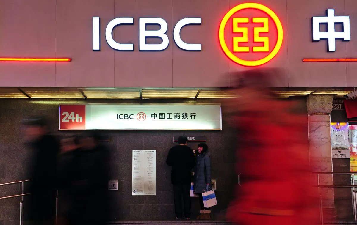Customers use an automated teller machine at a branch of the Industrial and Commercial Bank of China in Beijing, China, on Jan. 29, 2011. (Frederic J. Brown/AFP/Getty Images)