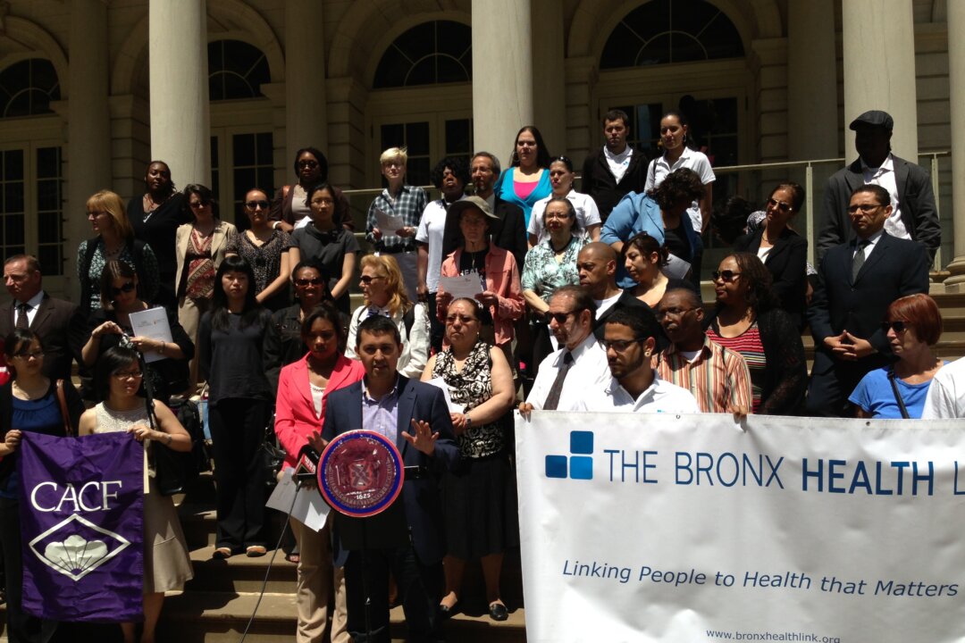 Anthony Feliciano, director of the Commission on the Public's Health System, speaks to the press on the steps of the City Hall in Downtown Manhattan on June 5, 2013. (Ivan Pentchoukov/The Epoch Times)