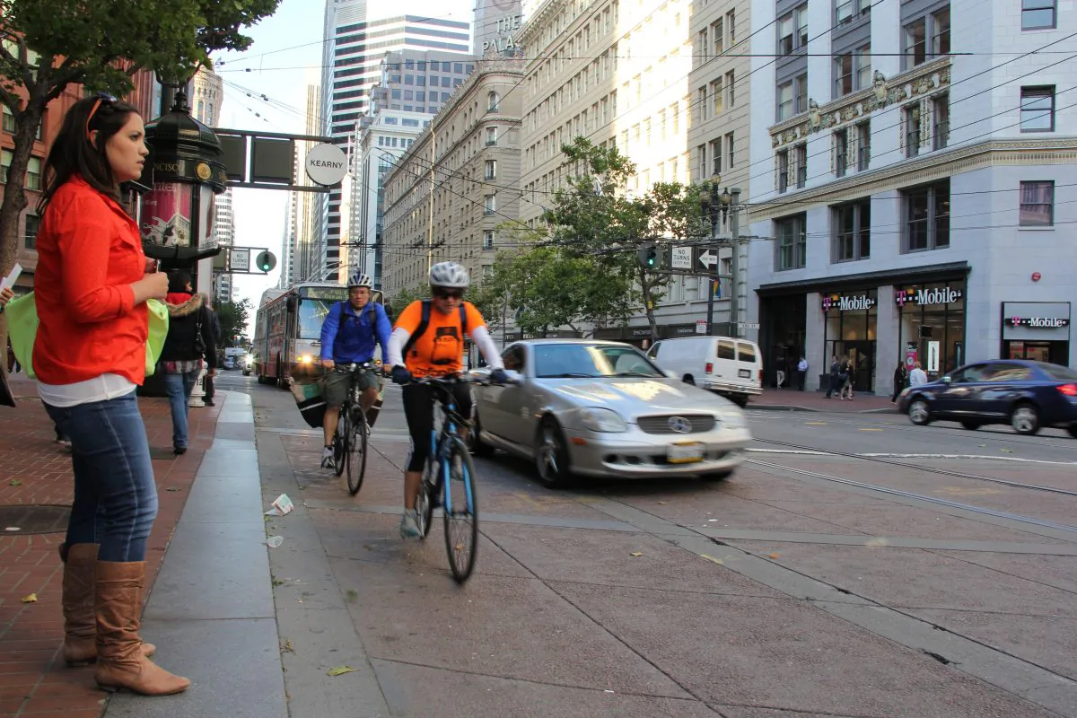 Pedestrians wait for the green light at rush hour on Market Street, San Francisco, Calif., June 18, 2013. City leaders have been criticizing the slow progress of the Better Market Street project, a revitalization effort for the city’s main thoroughfare. (Christian Watjen/Epoch Times)
